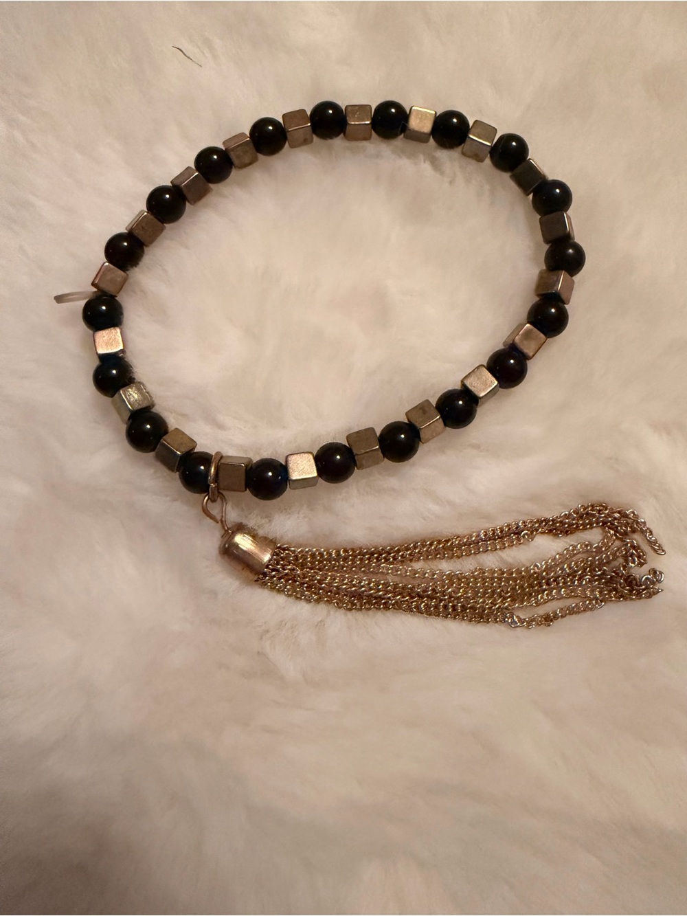 Black Beaded Bracelet with Gold Tassel Accent